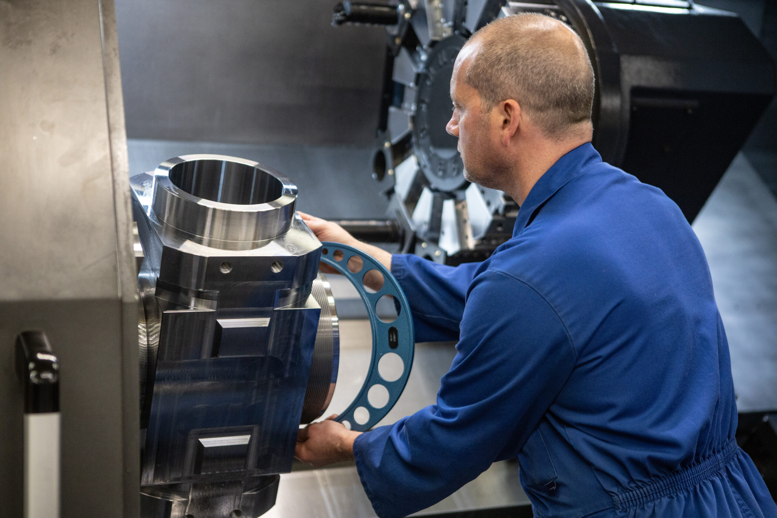 Employee handling one of our machines